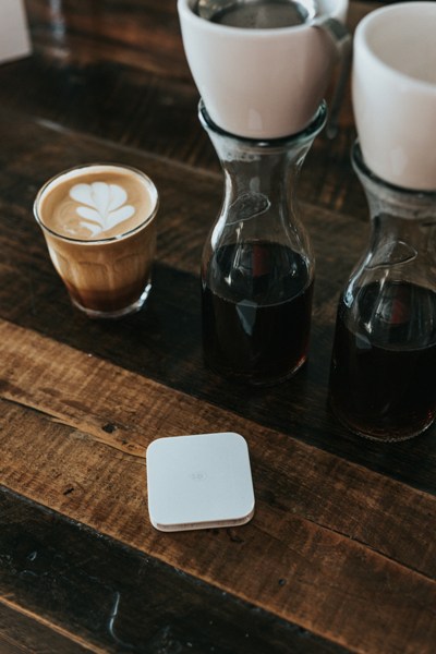 A cup of coffee on a table.